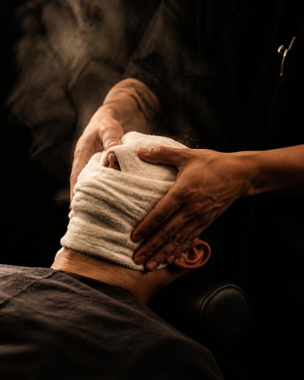 Hot towel shave prepared with a steaming towel